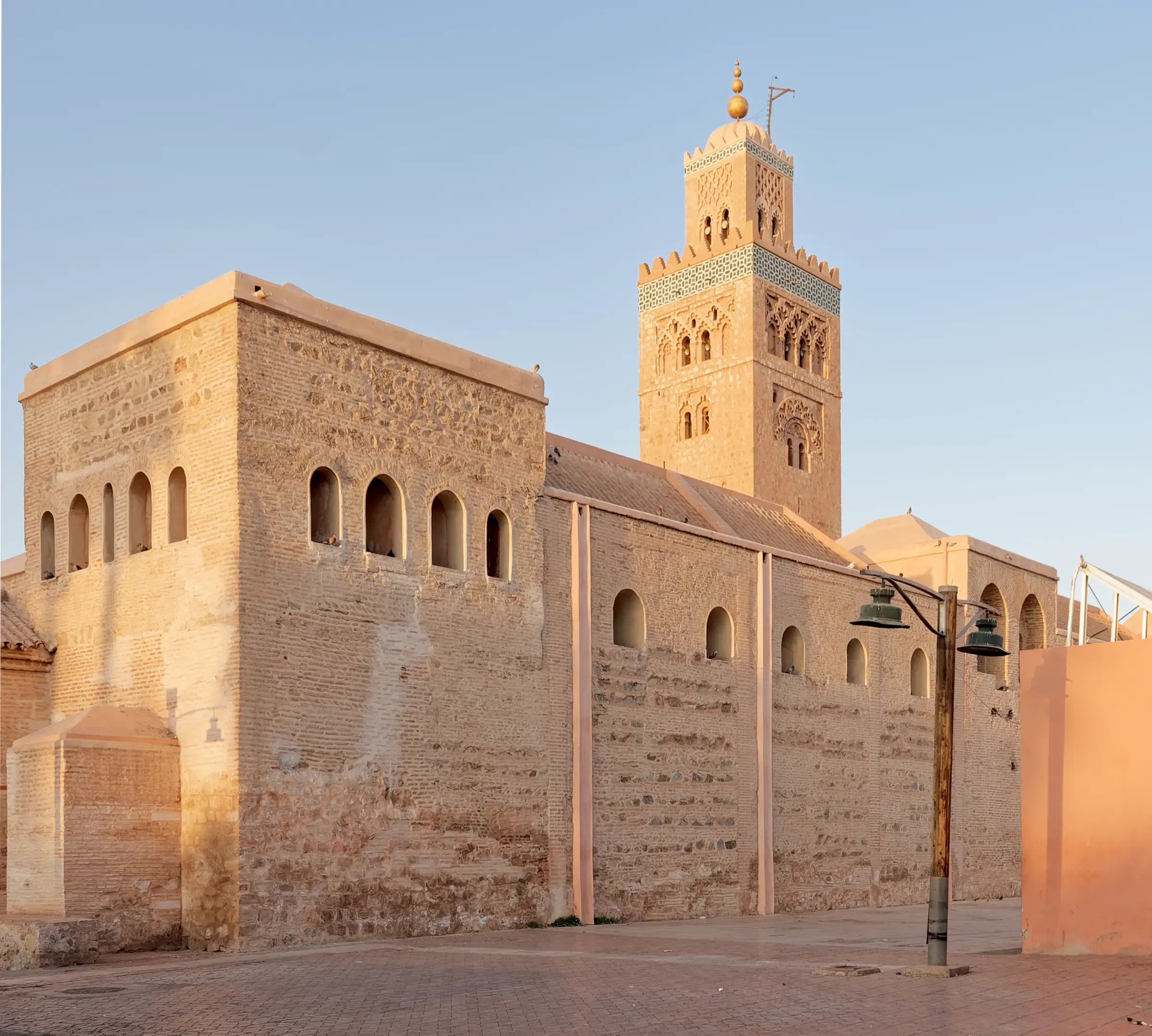 The Koutoubia Mosque and its ochre stone minaret in warm late-afternoon light