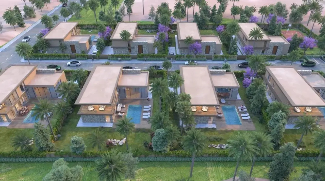 Vue aérienne du domaine : les huit villas et leurs piscines